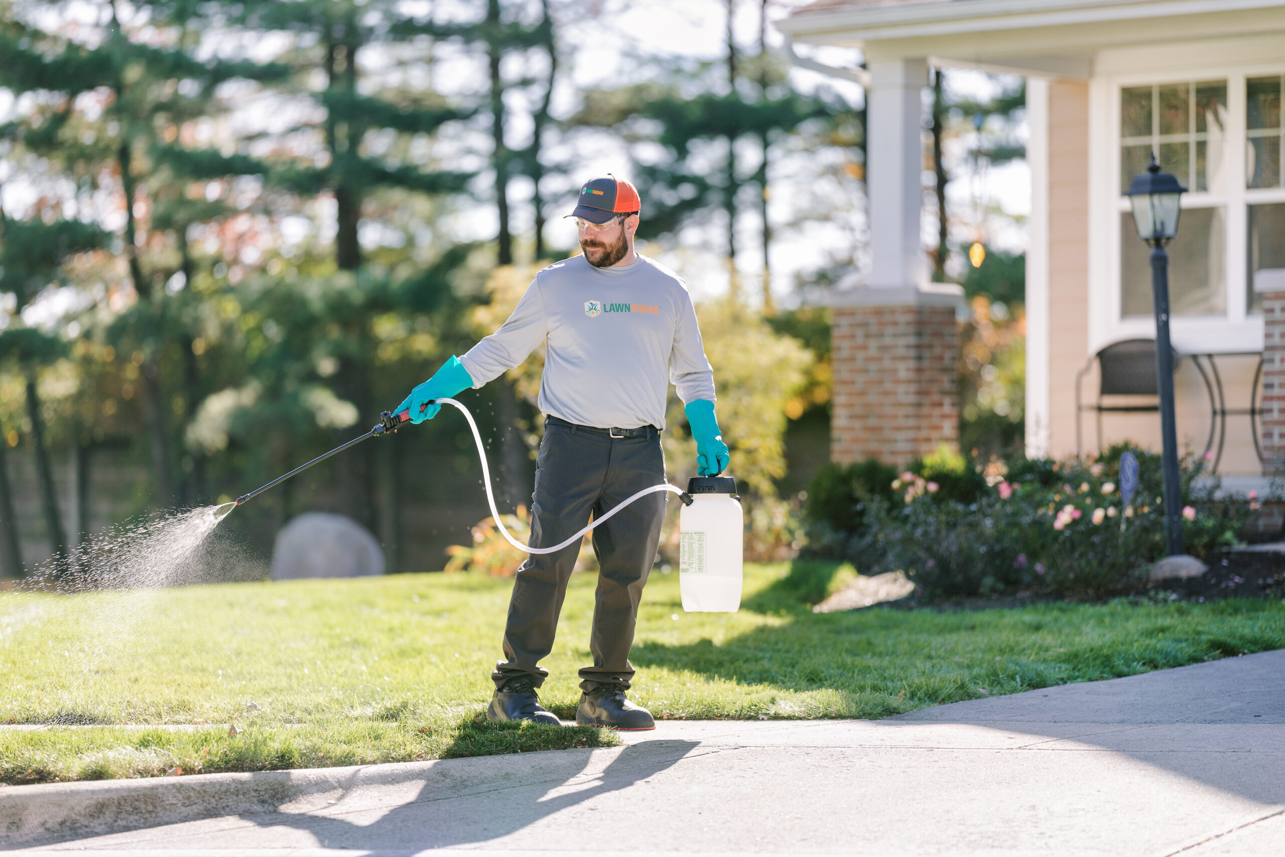 Spraying treatments onto the lawn